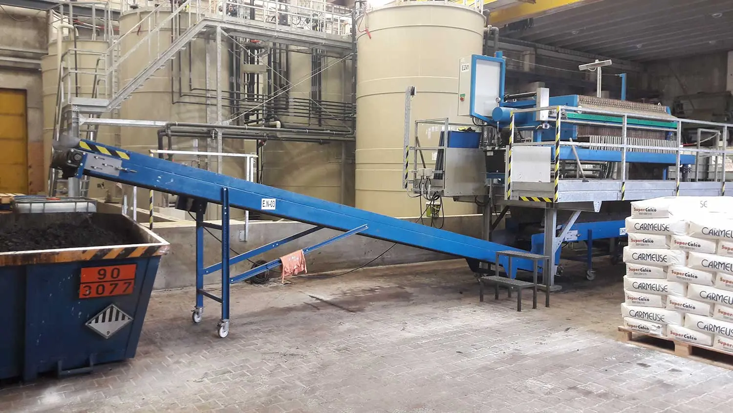 Filter press in industrial facility