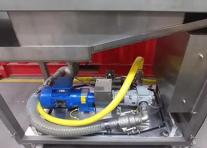 Pompy do kleju zamontowane w maszynie firmy MDP Engineering